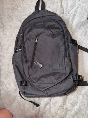 Material Black Everyday Backpack with Front Zip Pocket